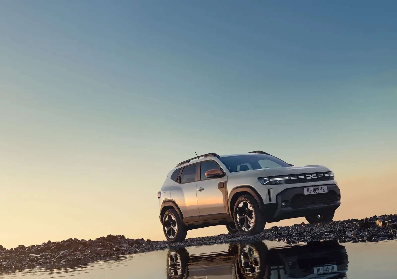 New 2026 Dacia Duster side view at sunset